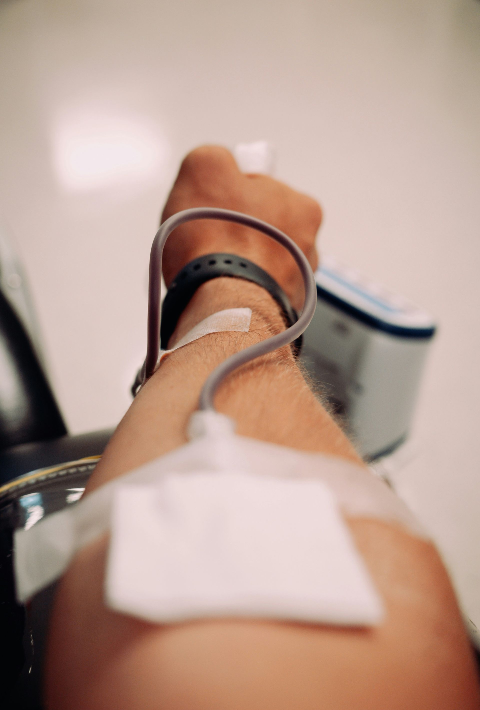 Someone's arm is being used for a medical procedure.